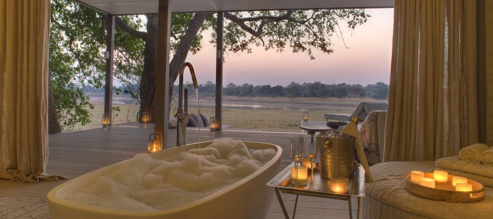 Even the luxurious private soaking tubs have beautiful views over the river at Chinzombo, South Luangwa National Park, Zambia - Image 15