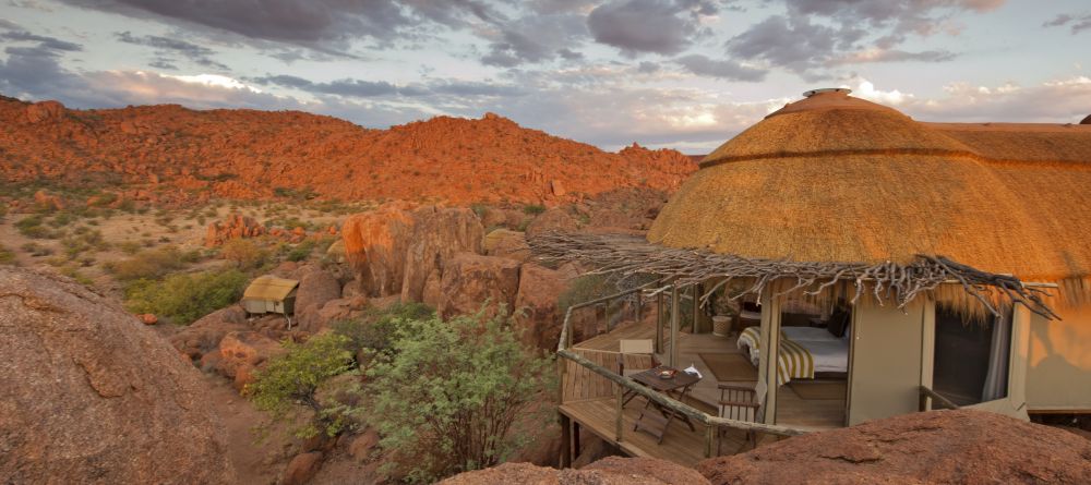 A suite with the bed and veranda overlooking the beautiful and unique landscape at Mowani Mountain Camp, Damaraland, Namibia - Image 2