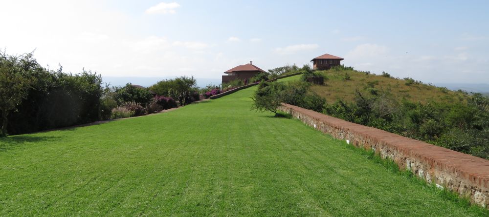 The sweeping manicured lawn extends up towards the main building at Bashay Rift Lodge, Karatu, Tanzania (Mango staff photo) - Image 11