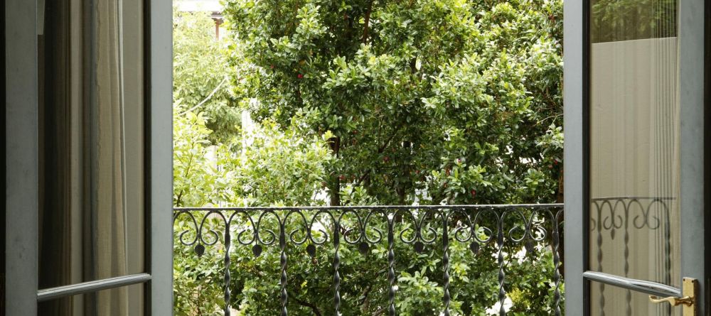 The view out of a guestroom onto the courtyard at Welgelegen Boutique Hotel, Cape Town, South Africa - Image 9