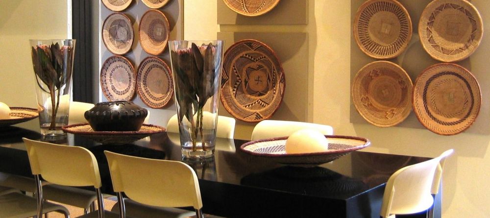 The dining room adorned with traditional weaved baskets at African Villa, Cape Town, South Africa - Image 4