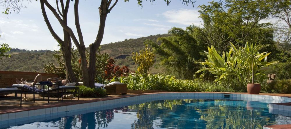 Relaxing by the pool at the Plantation Lodge, Karatu, Tanzania - Image 1