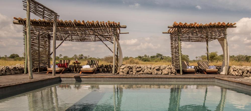 Soak up sun by the pool overlooking the nearby wildlife at Chem Chem Lodge, Lake Manyara National Park, Tanzania - Image 18