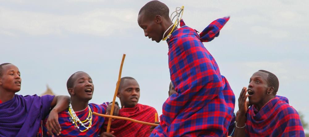 Masai tribesmen engage in a traditional jumping dance at Chem Chem Lodge, Lake Manyara National Park, Tanzania - Image 1