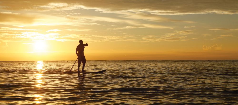 Paddle boarding at sunset at Desroches Island Resort, Desroches Island, Seychelles - Image 1