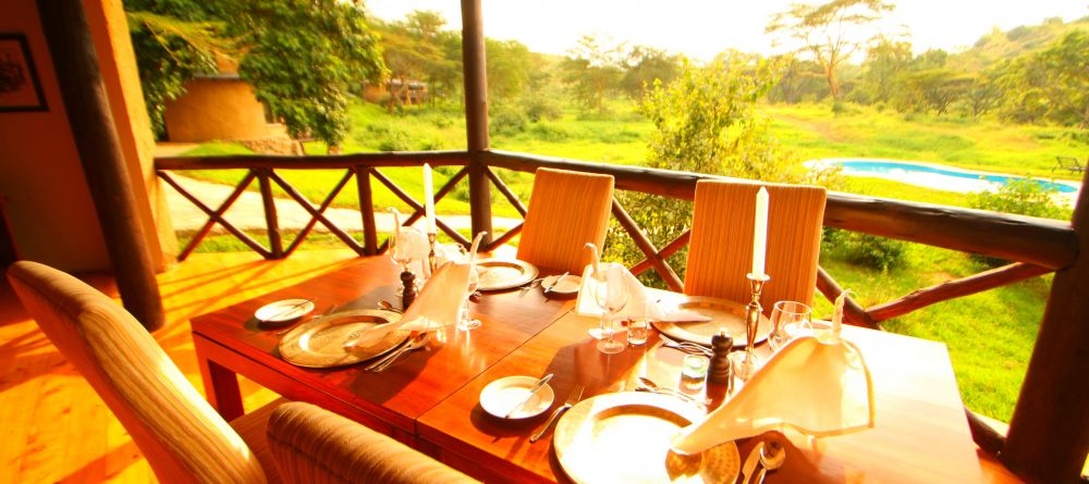 The dining area overlooks the pool and lush surroundings at The Emakoko, Nairobi National Park, Nairobi, Kenya - Image 5