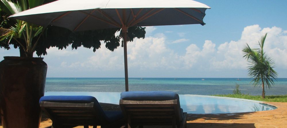 A shady place to relax by the pool at Fumba Beach Lodge, Zanzibar, Tanzania - Image 3