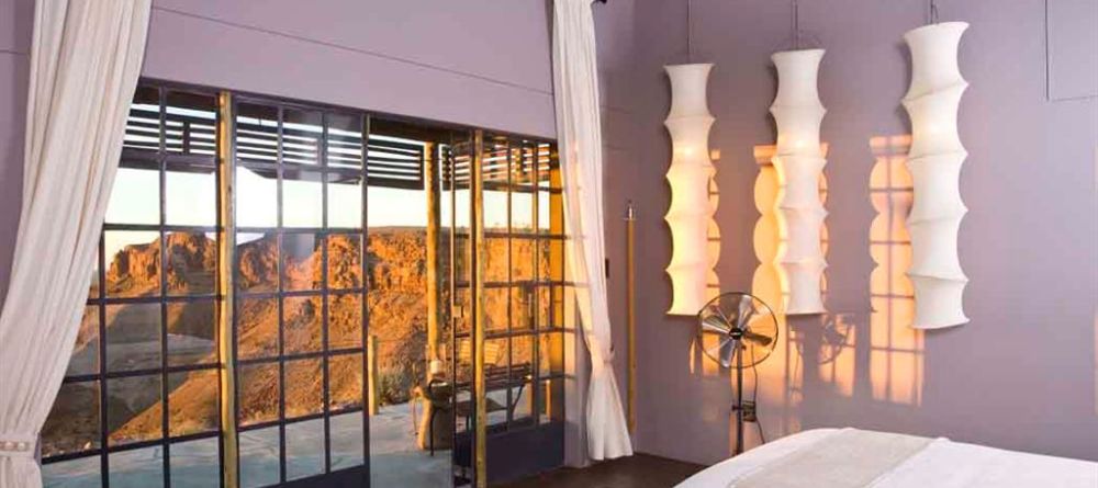 Fish River Canyon Lodge - Bedroom, Patio and Landscape View - Image 6