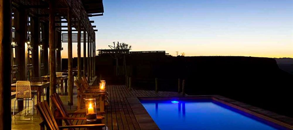 Fish River Lodge - Pool and Patio at Dusk - Image 19