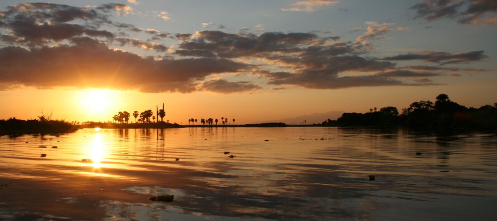 The sunset over the lake at Lake Manze Tented Camp, Selous National Park, Tanzania - Image 11