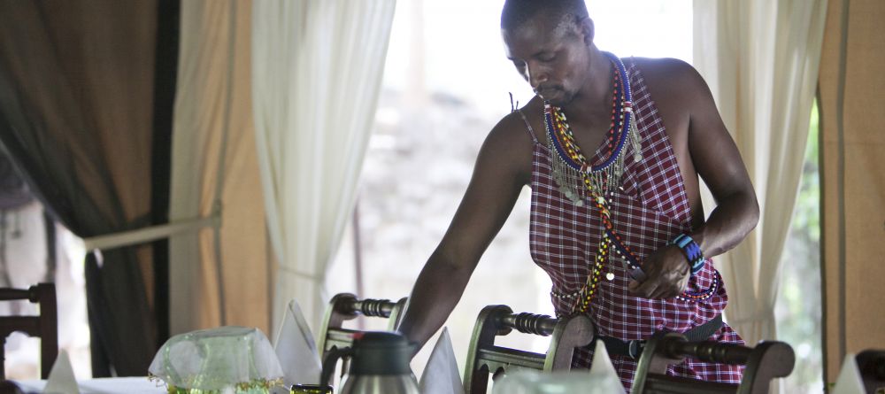 Setting the dining area at Ngare Serian Camp, Masai Mara National Reserve, Kenya - Image 1