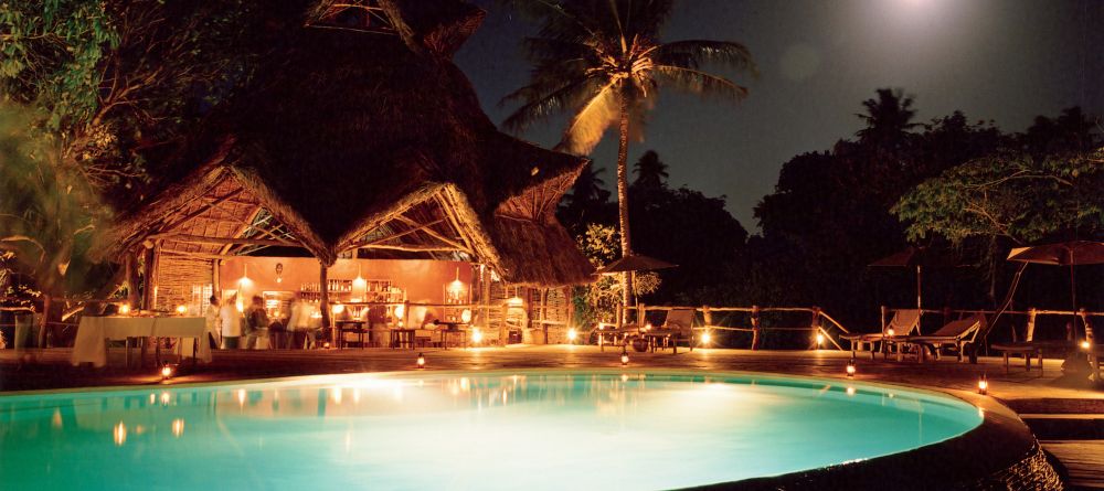 Pool lit up at night at Fundu Lagoon, Pemba Island, Tanzania - Image 2