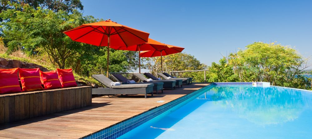 Enjoy the sun by the pool at Pumulani, Lake Malawi, Malawi - Image 14