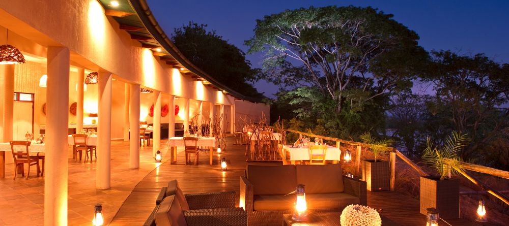 The veranda at night at Pumulani, Lake Malawi, Malawi - Image 1