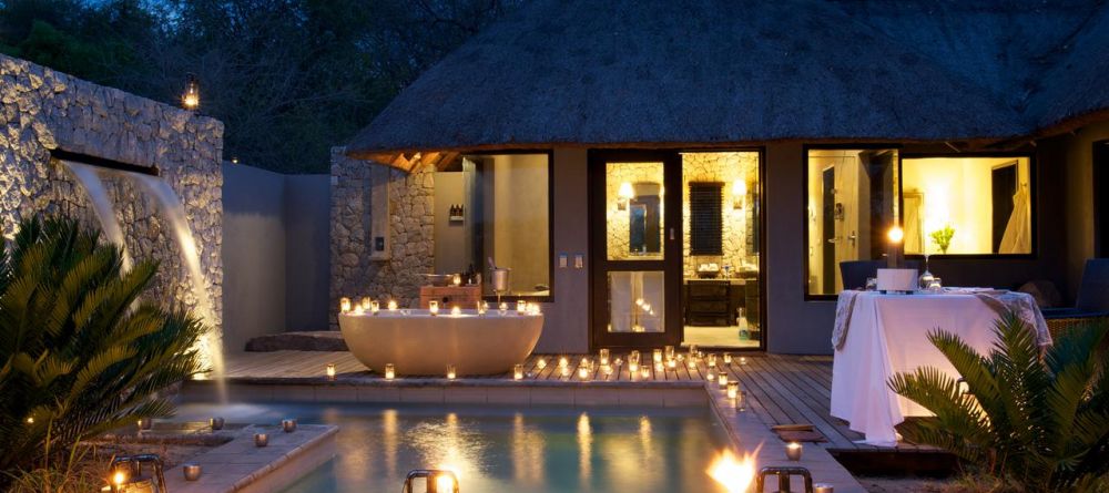 The peaceful private outdoor tub, plunge pool and veranda with dining at Londolozi Granite Suites, Sabi Sands Game Reserve, South Africa - Image 6