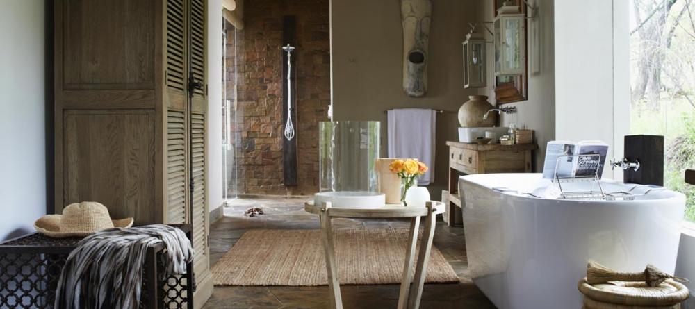 Luxurious bathrooms blend function and elegance at Singita Serengeti House, Serengeti Grumeti Reserves, Tanzania - Image 6