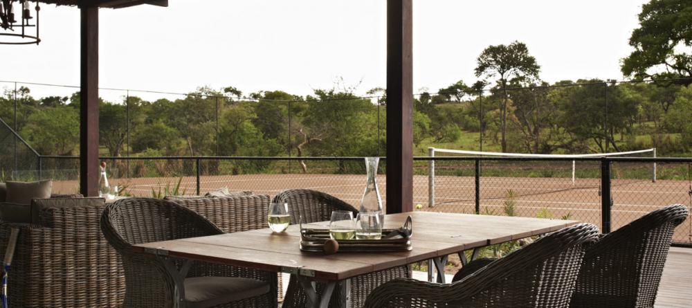 Tennis courts and outdoor dining allows guests to enjoy nature from the comfort of Singita Serengeti House, Serengeti Grumeti Reserves, Tanzania - Image 12