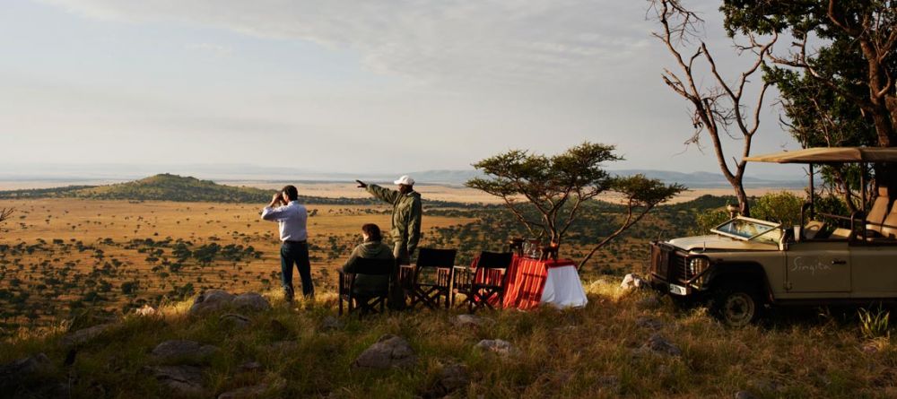 A moment of serenity during a sundowner at Singita Sasakwa Lodge, Grumeti Reserves, Tanzania - Image 9