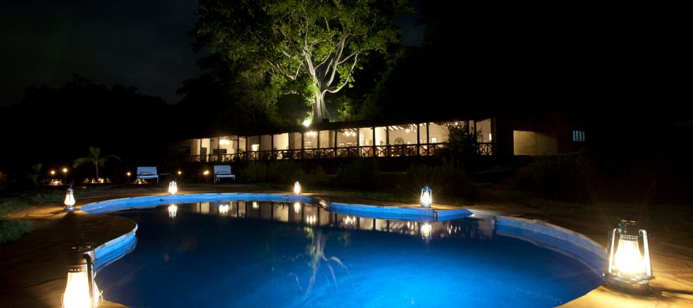 The pool illuminated at night at The Emakoko, Nairobi National Park, Nairobi, Kenya - Image 6