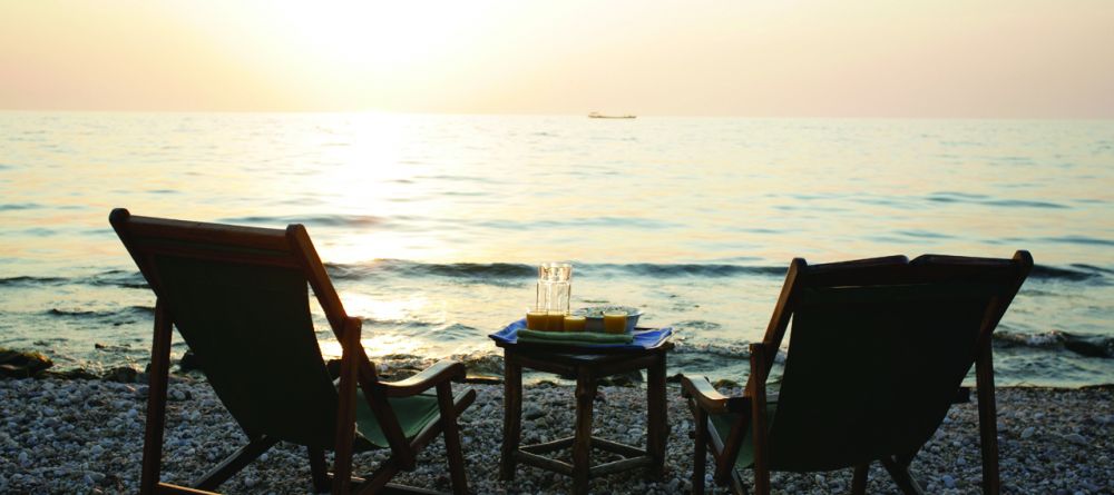 Watching the sunset from beach chairs at Gombe Forest Lodge, Gombe National Park, Tanzania - Image 9