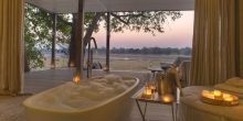 Even the luxurious private soaking tubs have beautiful views over the river at Chinzombo, South Luangwa National Park, Zambia