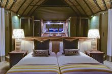 The bedroom with bathroom behind at Mowani Mountain Camp, Damaraland, Namibia