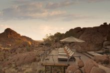 The veranda with pool and sunloungers at Mowani Mountain Camp, Damaraland, Namibia