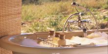 A private soaking tub for ultimate relaxation at Kwandwe River Lodge, Kwandwe Private Game Reserve, South Africa