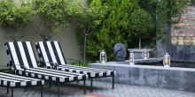 Sun loungers in the courtyard at Welgelegen Boutique Hotel, Cape Town, South Africa