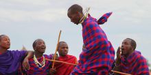 Masai tribesmen engage in a traditional jumping dance at Chem Chem Lodge, Lake Manyara National Park, Tanzania