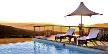 Watch the sunset over the valley from the pool at Delaire Graff, Stellenbosch, South Africa