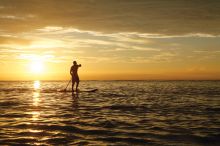 Paddle boarding at sunset at Desroches Island Resort, Desroches Island, Seychelles