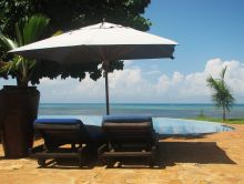 A shady place to relax by the pool at Fumba Beach Lodge, Zanzibar, Tanzania