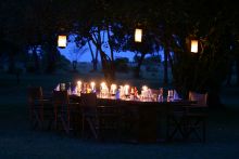 Outdoor evening dining at Richard's Camp, Masai Mara National Reserve, Kenya