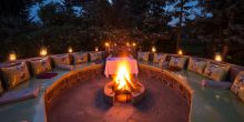 Fire pit at night at Amakoro Songa Lodge