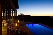 Fish River Lodge - Pool and Patio at Dusk