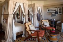 A luxury twin bedroom at The Four Seasons Safari Lodge, Serengeti National Park, Tanzania