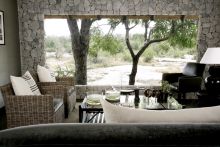 The lounge with a wonderful view of passing wildlife at Londolozi Granite Suites, Sabi Sands Game Reserve, South Africa