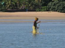 A local woman setting her fishing nets at Sakatia Lodge, Nosy Be, Madagascar (Mango Staff photo)