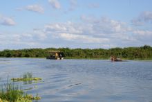 A hippo gets defensive of its territory when a boat safari comes too near at Lake Manze Tented Camp, Selous National Park, Tanzania