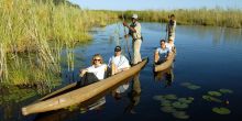 Boating at Little Vumbura, Okavango Delta, Botswana © Michael Poliza