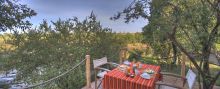 Breakfast on the patio overlooking the river at Naibor Camp, Masai Mara National Reserve, Kenya