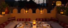 Intimate outdoor dining at Kasbah Tamadot, Atlas Mountains, Morocco