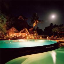 Pool lit up at night at Fundu Lagoon, Pemba Island, Tanzania