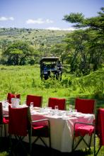 Safari meal on the Serengeti at Kleins Camp, Serengeti National Park, Tanzania Â© AndBeyond