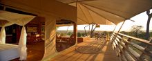 Private verandas offer guests breath-taking views of the sunset over the plains at Serengeti Bushtops Camp, Serengeti National Park, Tanzania