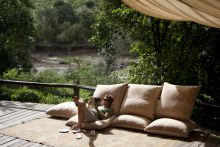 Patio reading and relaxation at Serian Camp, Masai Mara National Reserve, Kenya