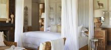 Elegant and comfortable bedrooms at Singita Serengeti House, Serengeti Grumeti Reserves, Tanzania