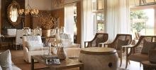 Enjoy time with family and friends in the lounge at Singita Serengeti House, Serengeti Grumeti Reserves, Tanzania