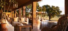 Watch the sunset over the savannah at Singita Serengeti House, Serengeti Grumeti Reserves, Tanzania